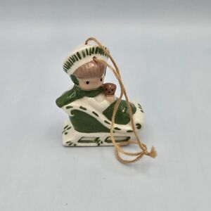 Vintage Ceramic Girl On Sleigh Christmas Ornament 1.75"